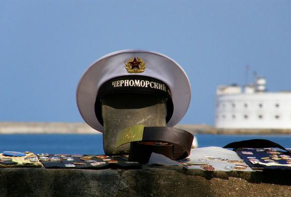 A Soviet-time sailor belt and cap with a designation of the Black Sea Fleet on sale on the boardwalk in Sevastopol